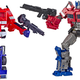 Hasbro’s original Transformers G1 Optimus Prime figure (re-issue) (Left) compared to its Transformers Studio Series Voyager Class Optimus Prime figure. (Right)